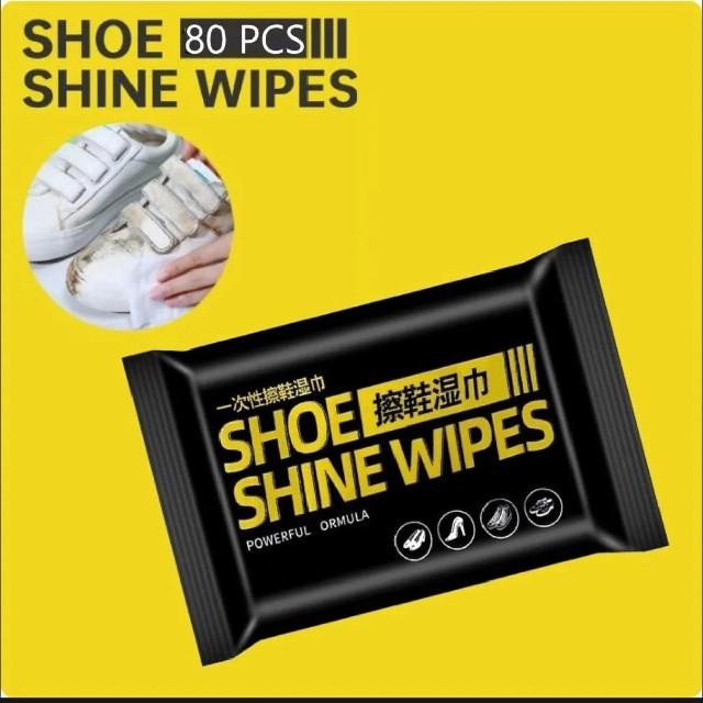 Pack of shoe shine wipes with a yellow background