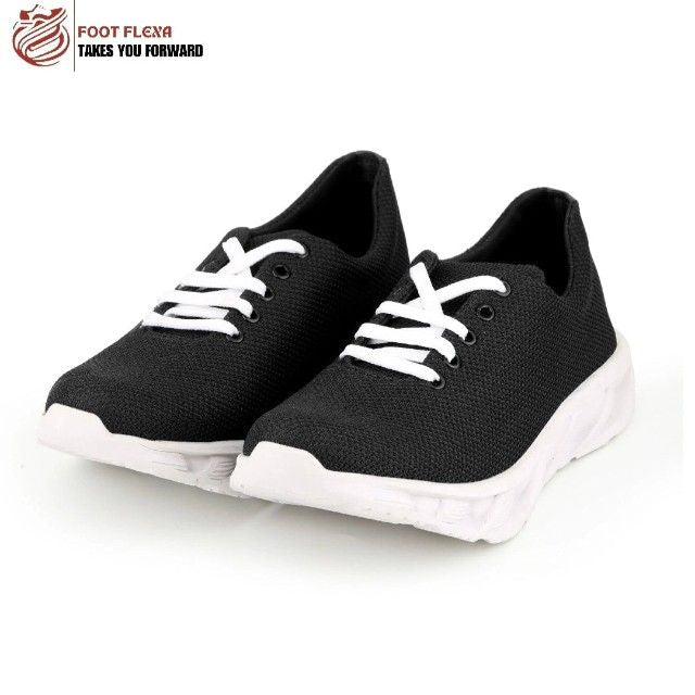 Black running shoes with white soles on a white background, featuring the 'Foot Flexa' brand.