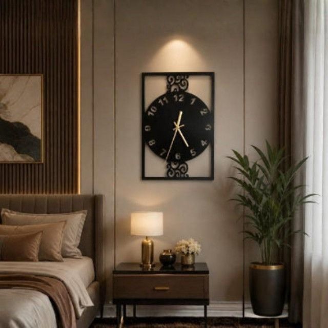 Decorative wall clock in a bedroom setting with a bed, nightstand, and plant.